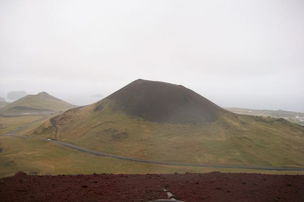 Helgafell, the supposedly dormant volcano, seen from the slopes of Eldfell, the volcano created by Helgafell’s eruption.