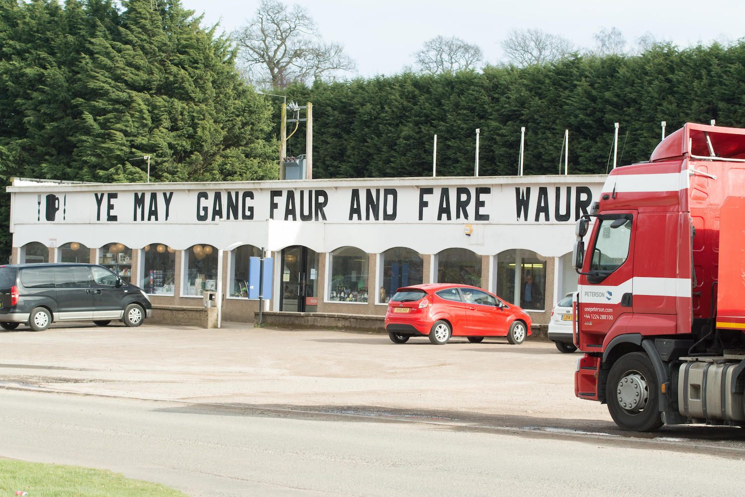 A gas station in Scotland with the Scots phrase 'Ye may gang faur an fare waur' - You may go further and do a lot worse.