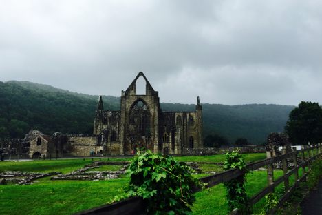 Tintern Abbey, with the mountains that surround the Wye River Valley in the background.