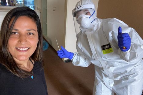 Noam Shuster-Eliassi snags a selfie while getting tested for COVID-19. Recovering coronavirus patients can leave the hotel after two negative tests.