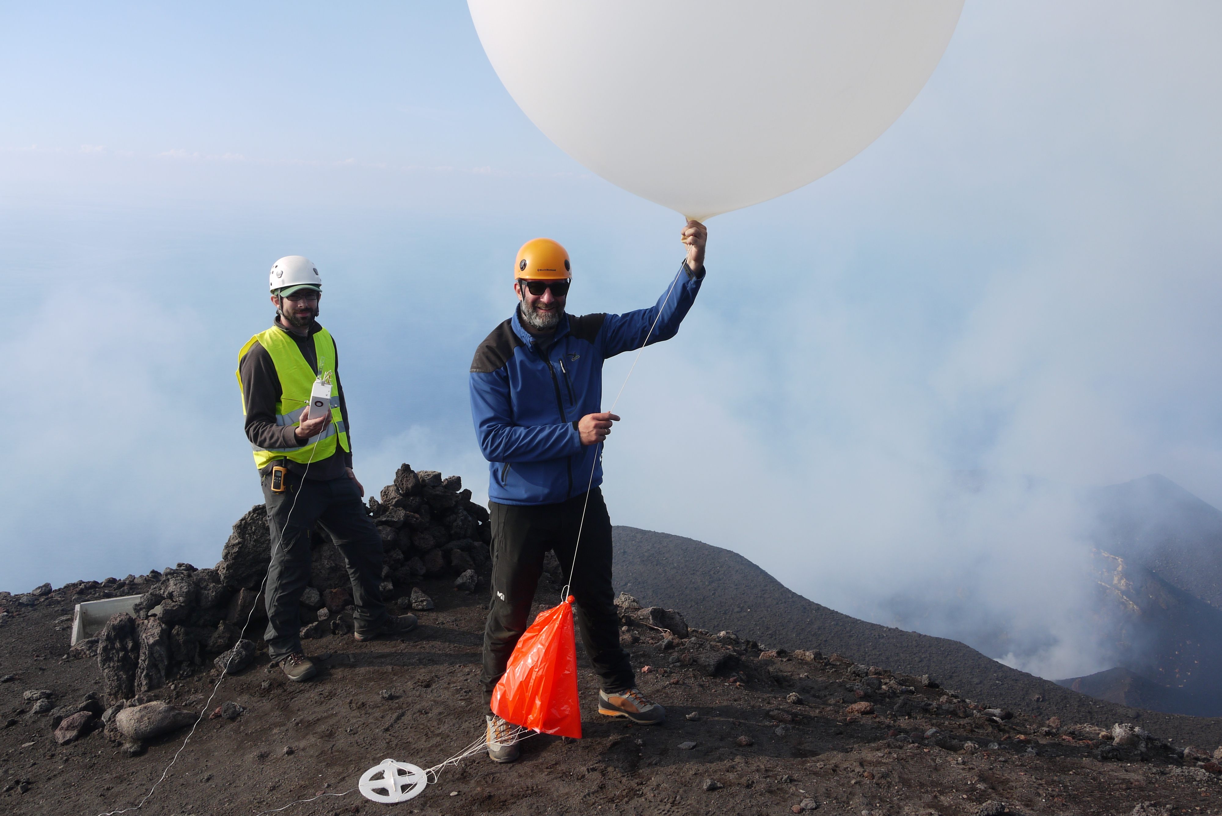Researchers get ready to launch a balloon sensor over Stromboli.