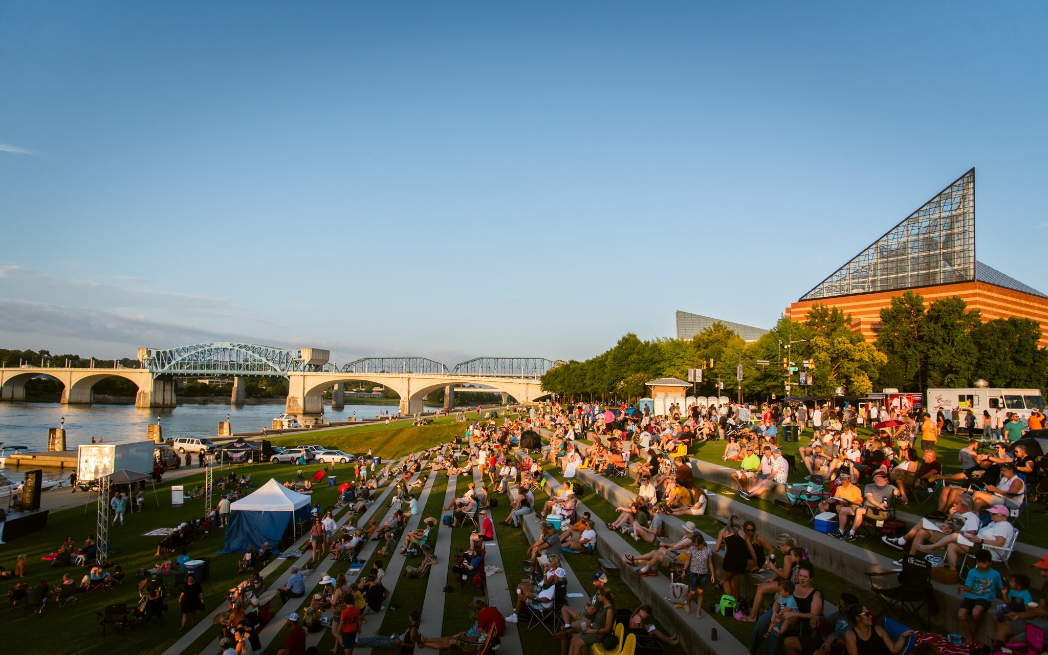 Visitors gather for waterfront performances at Ross’s Landing.