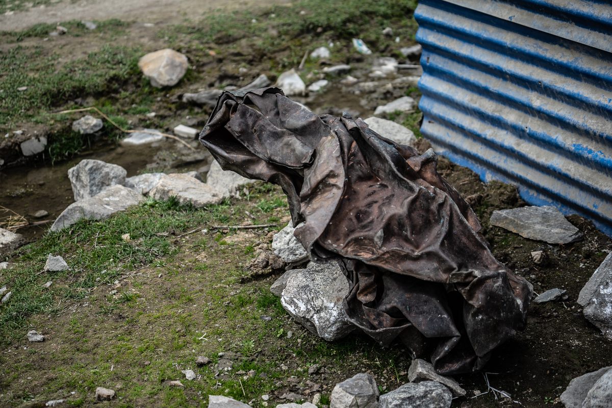 Wreckage from the 2015 earthquake lingers outside the factory.