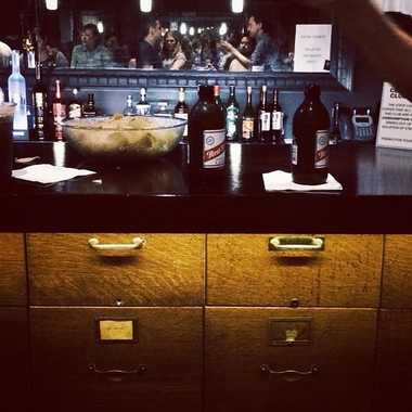 The bar counter is set on a filing cabinet.