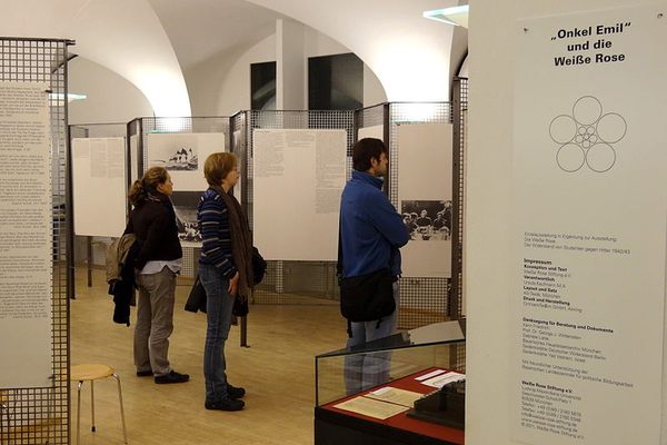 Visitors viewing exhibits in the White Rose memorial exhibition.