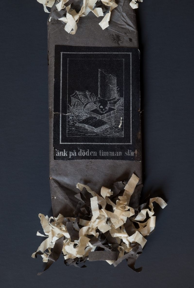 "Think of death, the hour strikes!" reads this piece of candy.