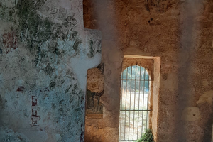 Through the rusty bars to the abbey's interior