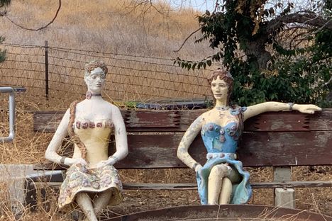 For artist John Enh's family, many of the statues that make up Old Trapper's Lodge, like these two women sitting on the campus of Pierce College, are tributes to lost loved ones. 