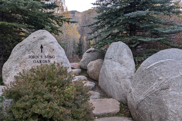 The blue spruce on the right symbolizes the spirit of John Denver.