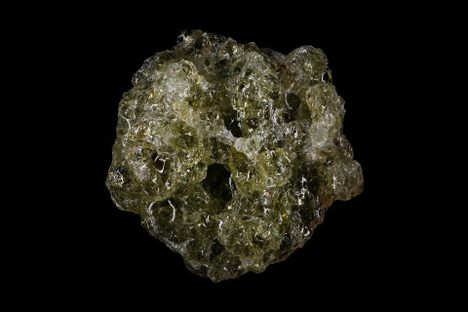 A tiny piece of trinitite, close up.