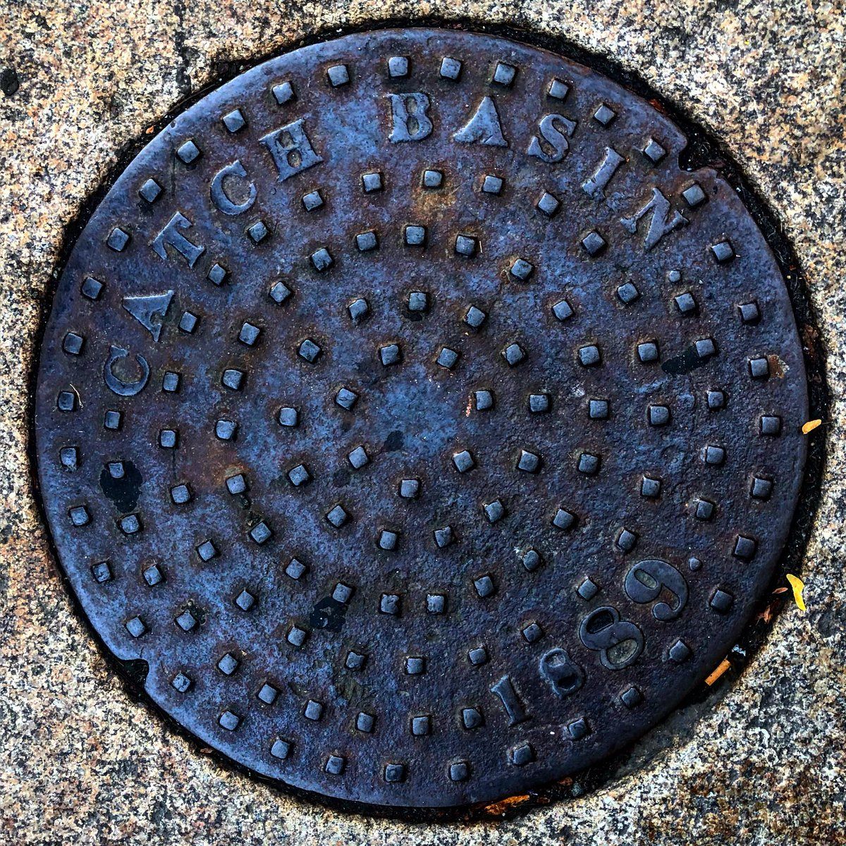 A Somerville manhole cover. You can see the different fonts used to inscribe the year.