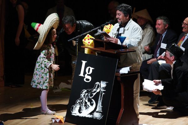Chemistry Ig Nobel winner Javier Morales gets interrupted by Miss Sweetie Poo in 2009. Morales and his cohort discovered a way to turn tequila into diamonds. (Photo: ) 
