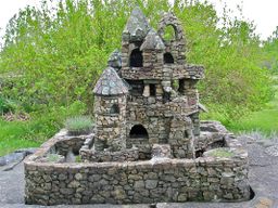A castle on its leafy grounds.