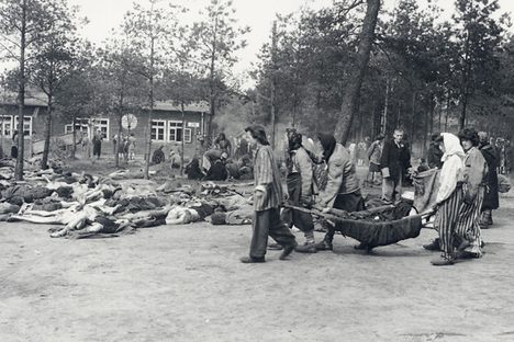 Inmates carry bodies out of barracks to bury them