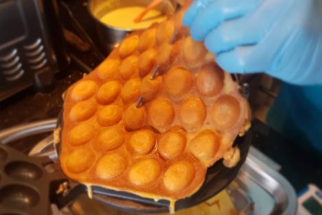 Lifting a fresh eggette from the skillet.