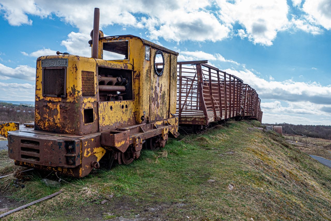 This rusting yellow train is a 1950s-era piece of industrial mining equipment which has found a new life as the iconic entry sculpture to Lough Boora Discovery Park.