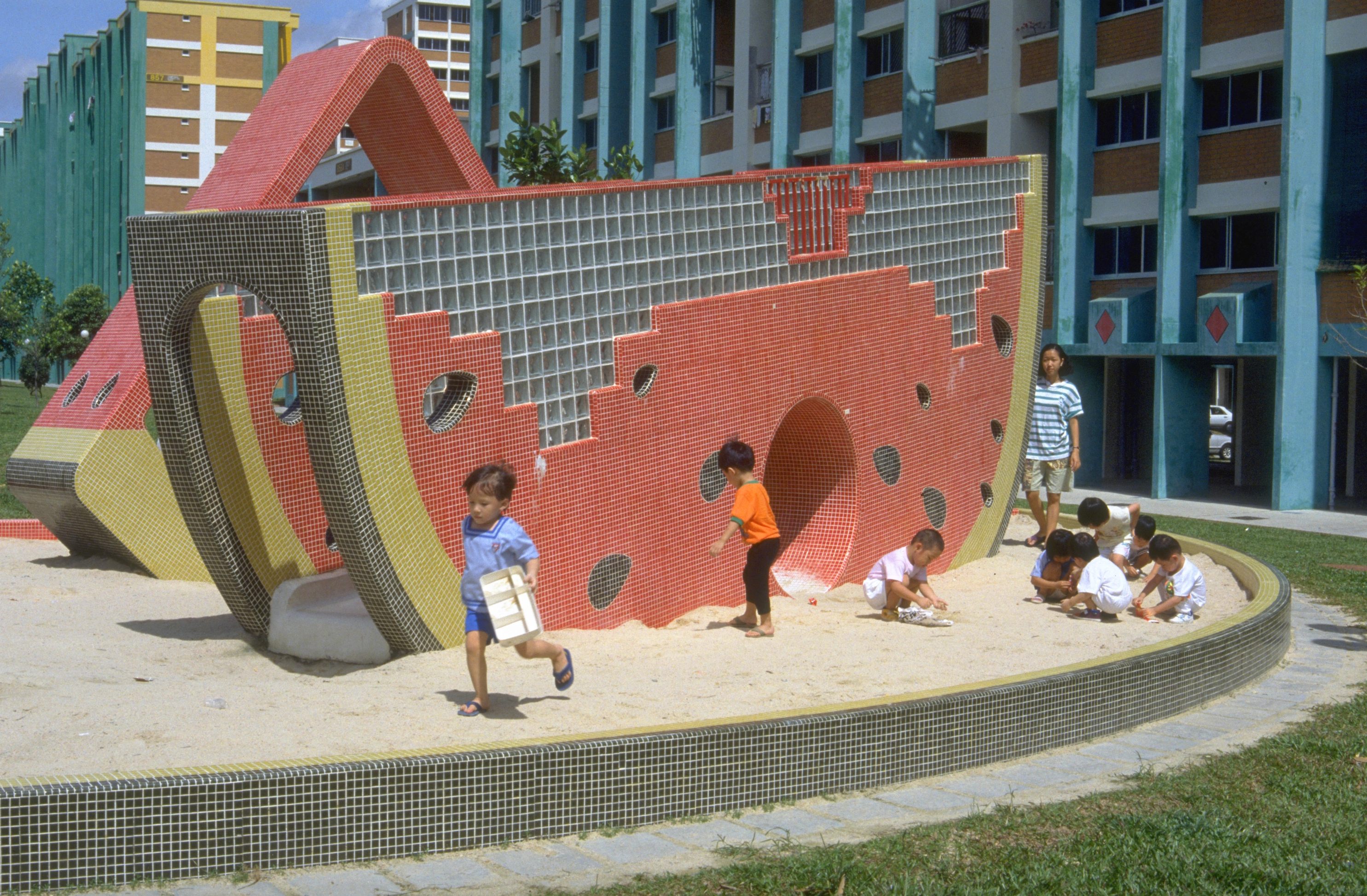 Children play next to a giant watermelon at the Tampines housing estate in 1993.