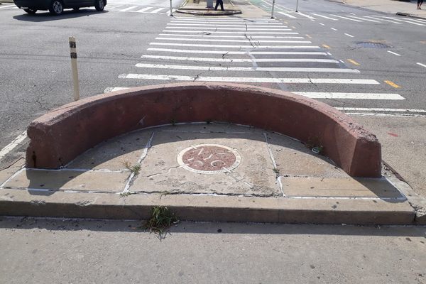 The Geographic Center of NYC is located on a traffic meridian on Queens Boulevard.