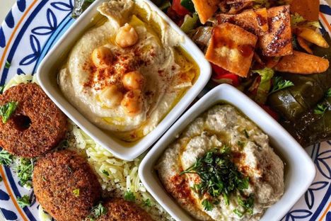 House-made hummus, falafel, and dolmas (stuffed grape leaves) at Jasmine Syrian. 