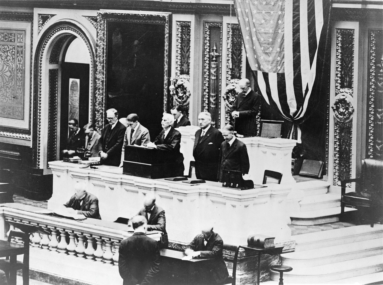 House of Representatives Chaplain Henry N. Couden opens the day by praying for the recovery of President Woodrow Wilson.
