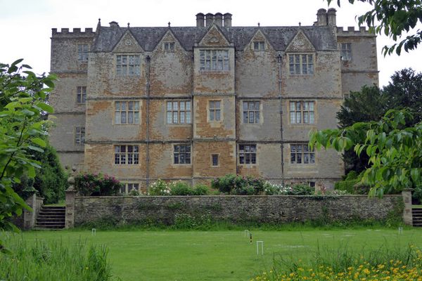 Chastleton House across the croquet lawn.