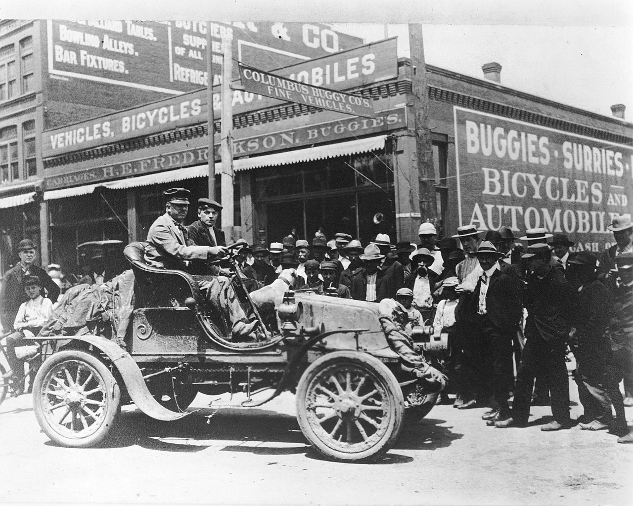 Jackson (at the wheel) and Crocker arrive in Omaha, Nebraska, about halfway on the very first drive across the country. 