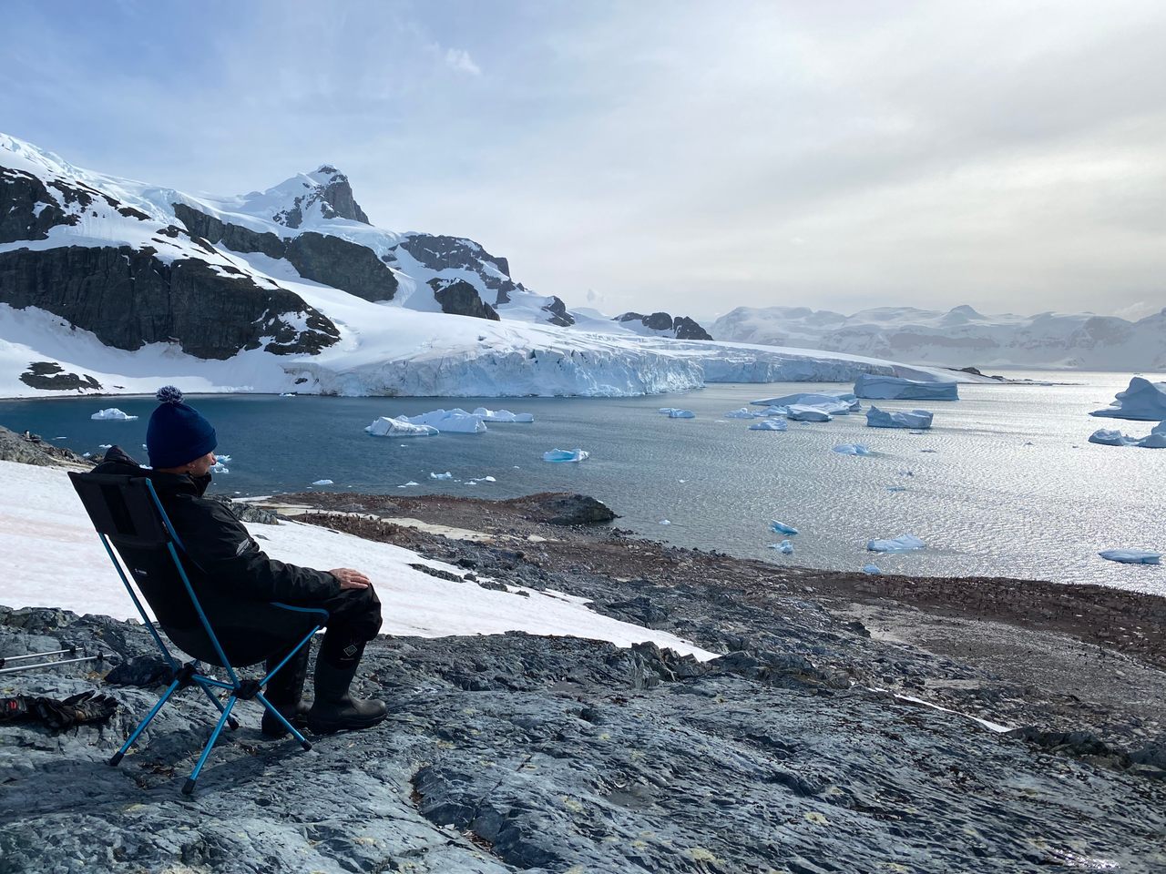 Robert "Robby" Silk, the first competitive chair-sitter, tests his stamina on Antarctica's Cuverville Island. 
