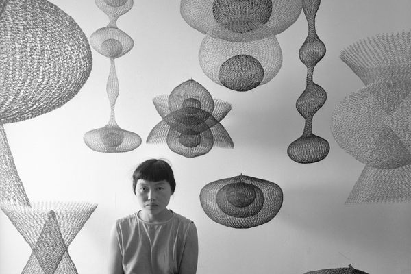 Ruth Asawa and some of her works in 1954. 