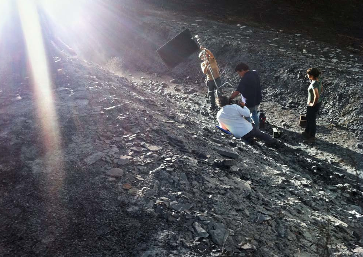While filming C.H.Z., crew members reflect light onto the streambed.