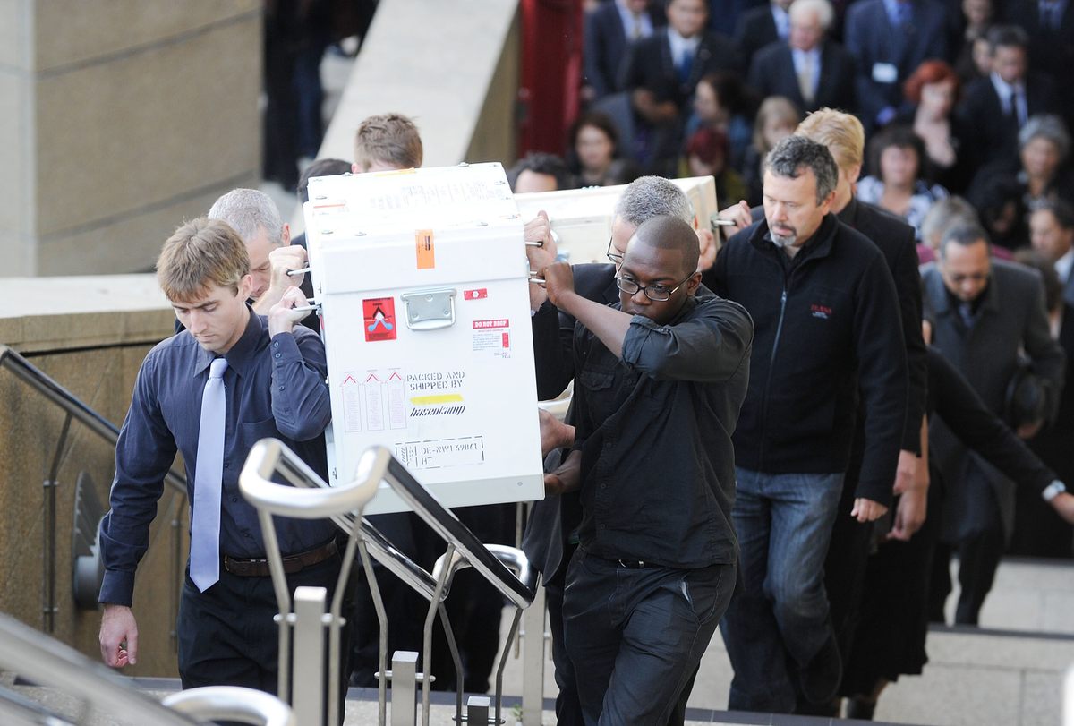 Te Papa staff carry boxes containing toi moko repatriated from France on May 12, 2011.
