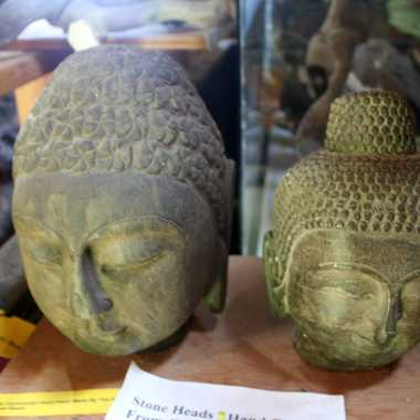 Carved heads on display.