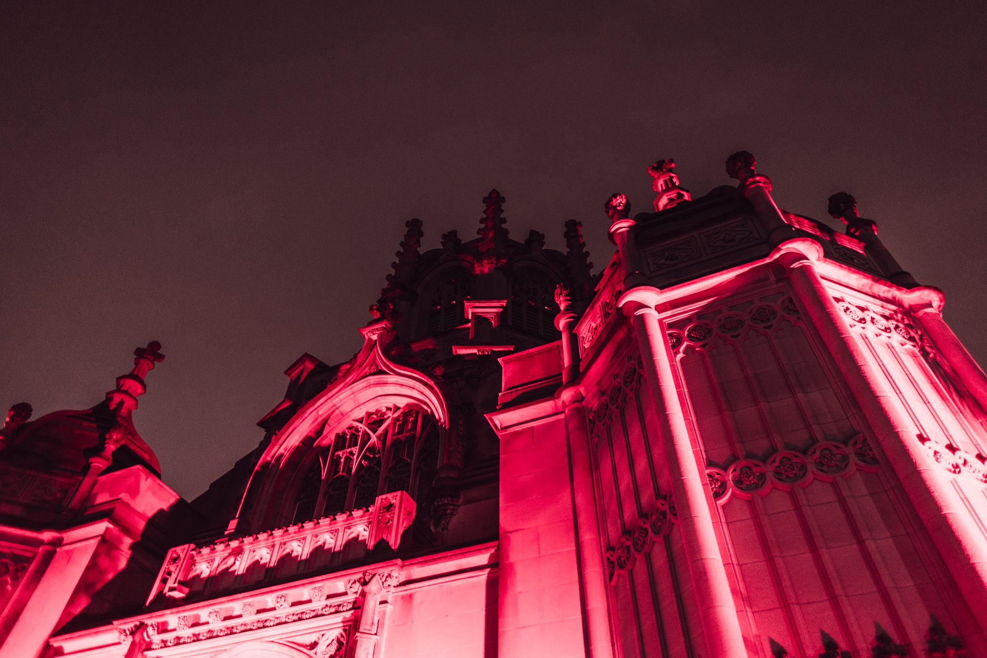 The Gothic arches of Green-Wood's chapel were underlit a deep crimson.