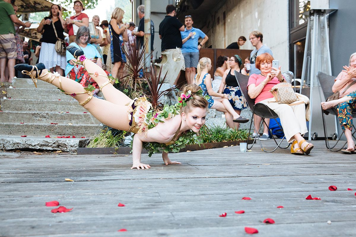 The contortionist Meg Russell gets low among the flowers.