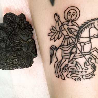 St. George and the Dragon tattoo motif as tattooed from a stencil block that dates to 200 or 300 years ago.