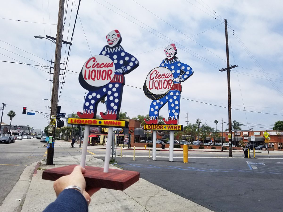 The creepily iconic Circus Liquor sign in North Hollywood is 32 feet tall. The creepily iconic model in Raley's hand measures 18 inches.