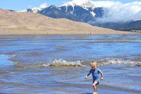 A young splasher enjoys surge flow season in 2015.