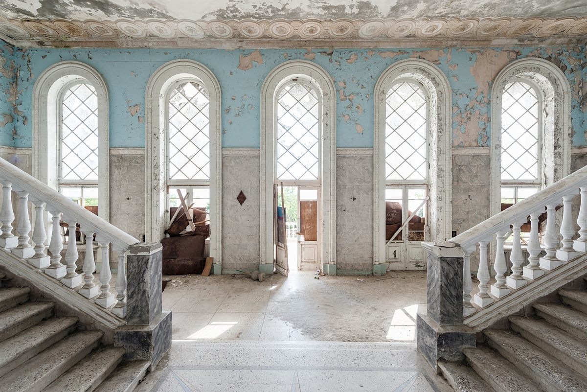 The impressive entrance hallway to a sanatorium in Abkhazia. It had been converted into a hotel, but was abandoned during the Abkhaz-Georgian conflict.