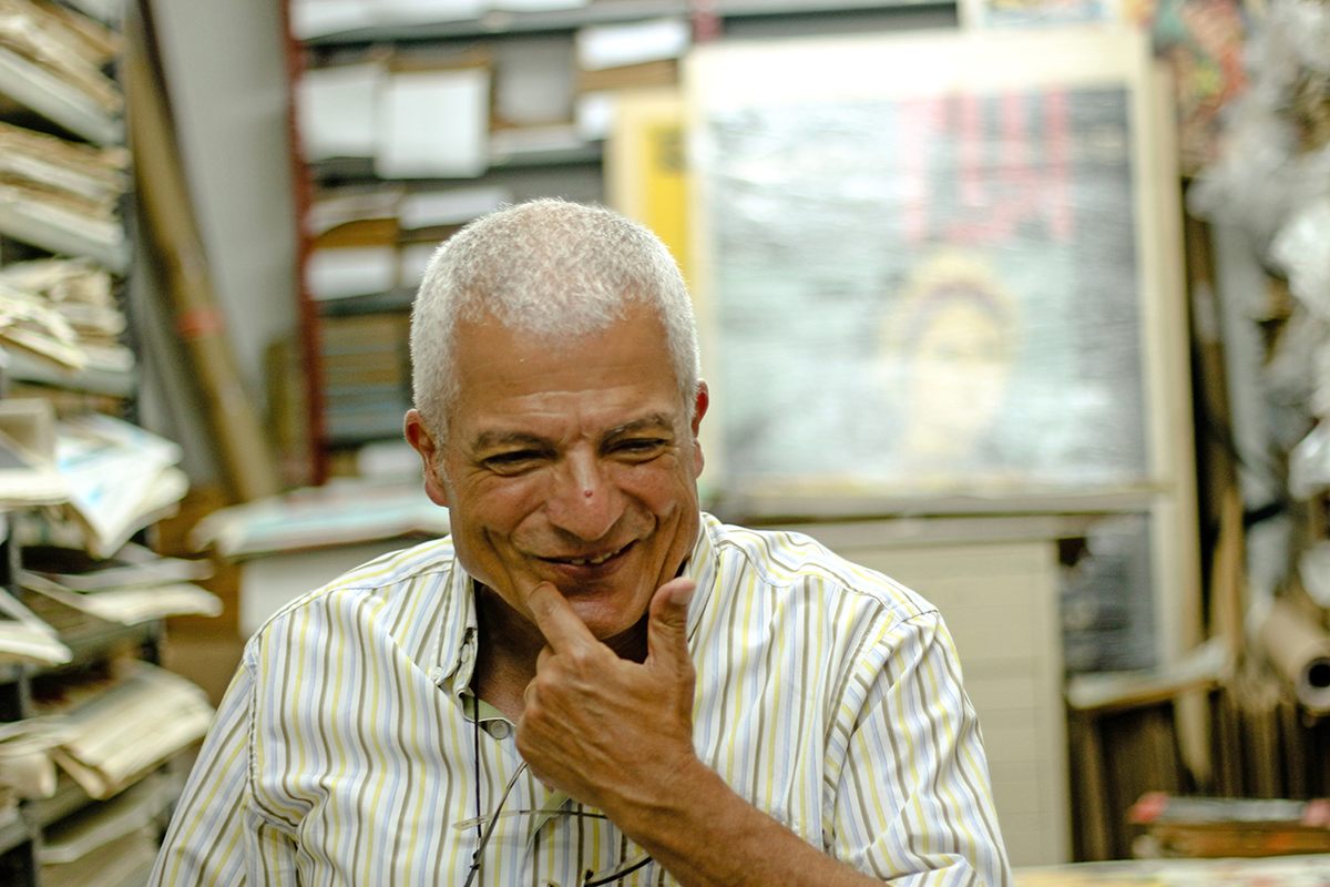 Abboudi Abou Joudé surrounded by his colorful collection.
