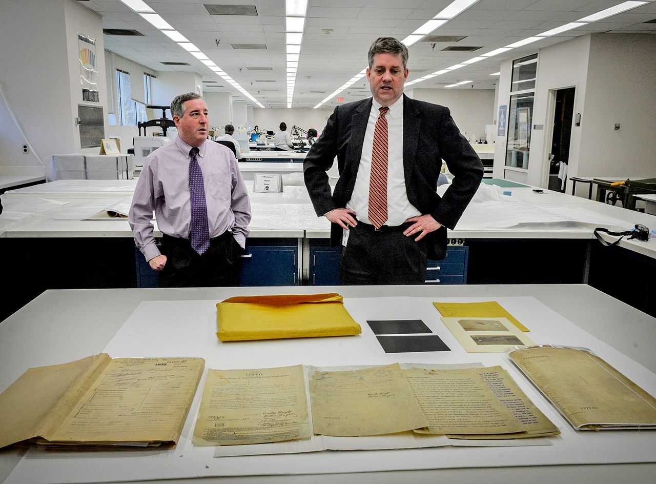 Mitch Yockelson (left), investigative archivist, and Jay Bosanko (right), COO of the National Archives, with recently rediscovered documents in 2016.
