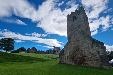 St Hilary's Chapel tower with Denbigh Castle behind it.