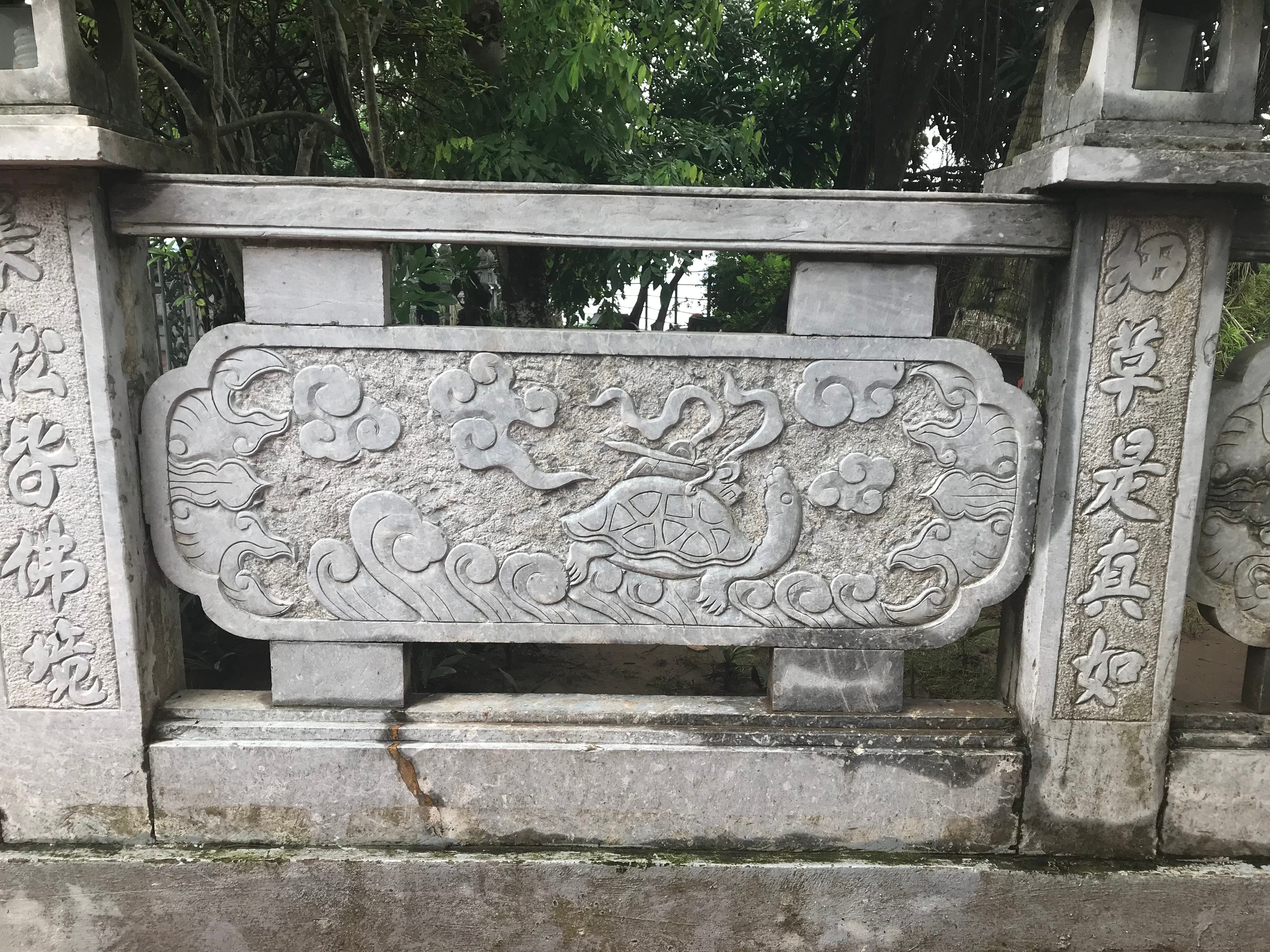 Relief from Trấn Quốc Pagoda, featuring the turtle with a sword on its back.