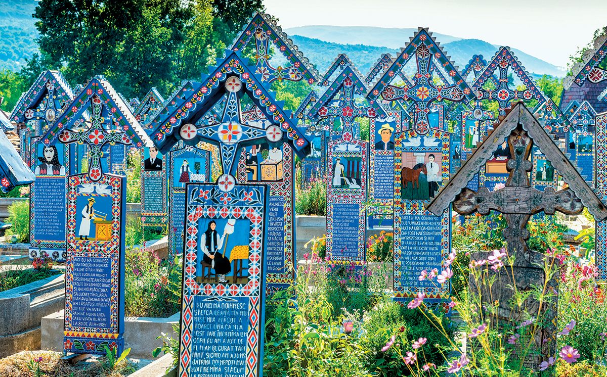 Markers in Merry Cemetery in Romania include poems about the deceased.