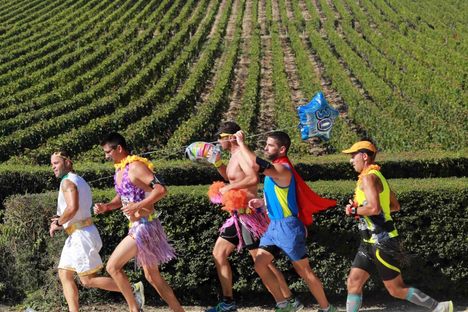 Running past vineyards.