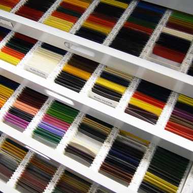 Drawers of samples of dried paint on glass slides.