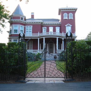 The house with a hedge around it