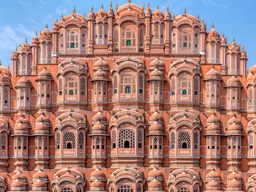 Sir Edwin Arnold thought Hawa Mahal was "a vision of daring and dainty loveliness, of storeys of rosy masonry and delicate overhanging balconies and latticed windows. Soaring with tier after tier of fanciful architecture in a pyramidal form, a very mountain of airy and audacious beauty through the thousand pierced screens and gilded arches of which the Indian air blows cool over the flat roofs of the very highest house." As quoted in, Delhi Agra Jaipur, by Surendra Sahai.  See more at https://kimcarpenterphotos.smugmug.com/Hawa-Mahal-Jaipur-India/.