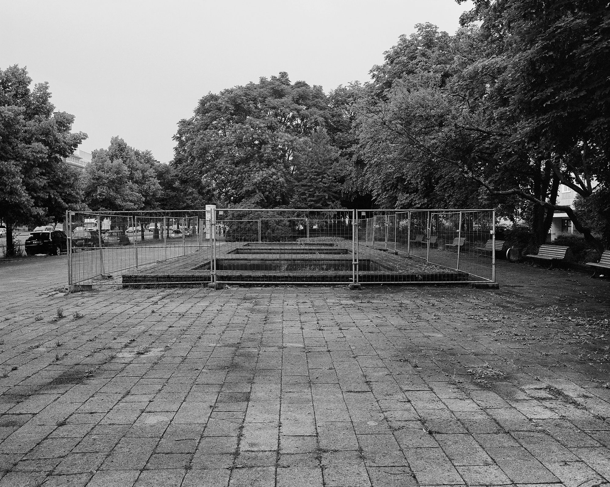 <em>Stalin, Berlin, Germany</em> (2017): “The local municipality attempted to repurpose this spot by putting a fountain in place of the statue of Stalin, but the fountain doesn’t work. Instead of fixing it, the authorities erected a construction barrier around it, which, as far as I know, is how it stands today.”