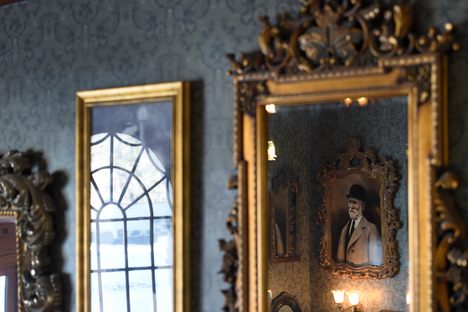 Mirrors and images of previous owners line the walls at the Stanley Hotel in Estes Park, Colorado. Now best known for inspiring the setting of The Shining, the building is reportedly one of America's most haunted hotels.