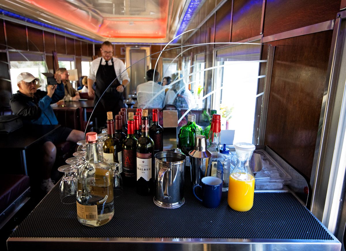Lou Capwell serves drinks at the on-board bar at the Blue Ridge Club. 