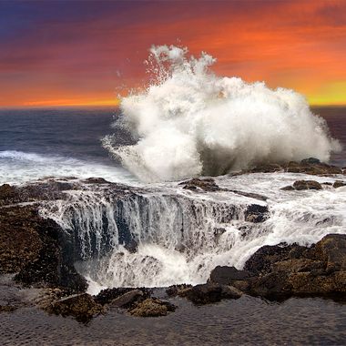 Waves crash against the rocks near Thor's Well in Oregon.